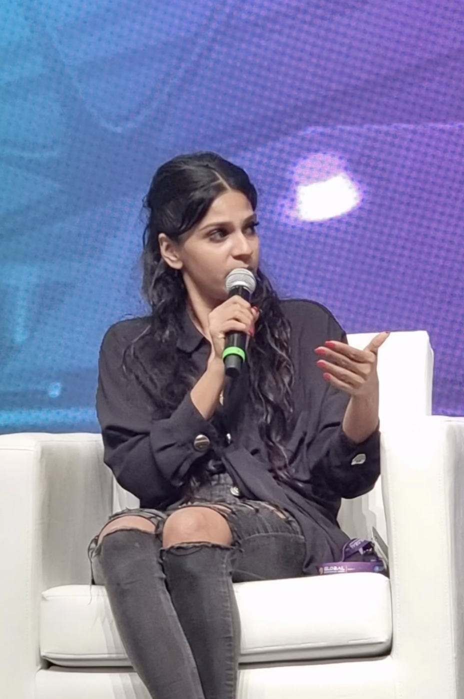 Sharmini speaking on a panel